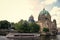 Berlin, Germany - July 21, 2019: protestant church seen from river. Cathedral or dom. Religious building. Baroque