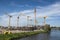 BERLIN, GERMANY, MAY 24, 2018: Many operating cranes at building site in Berlin, beside a canal.