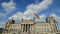 BERLIN GERMANY MAY 26 2017 German flags fluttering in the wind and building of Reichstagin on blue sky background