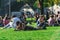 BERLIN, GERMANY - SEPTEMBER 26, 2018: tattooed man relaxing with a focus in a man laying down in the grass and writing