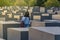 BERLIN, GERMANY - SEPTEMBER 26, 2018: Woman walks trought blocks of the Memorial to the Murdered Jews of Europe, with a