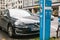 Berlin, October 1, 2017: The electric car is being charged at a special place for charging electric vehicles. A modern