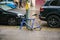 Berlin, October 2, 2017: Blue bicycle attached to street pillar with lock stands without wheels after being stolen in