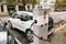 Berlin, October 2, 2017: The electric car is being charged at a special place for charging electric vehicles. A modern