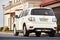 Berlin - October 2021: white metallic SUV japanese 4x4 car Nissan Patrol 6th Sixth generation Y62 V8 with trailer device