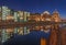 Berlin - Panorama of modern buildings on the riverside and Reichstag over the Spree river in evening dusk