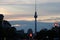 Berlin TV tower silhouette at dusk against sunset clouds from Karl Marx Allee, Berlin