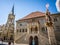 Bern Rathaus city hall front view with top of Vennerbrunnen or standard-bearer fountain and church in Bern old town Switzerland