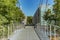 Bern, Switzerland - July 30, 2019: A wide metal mounted pedestrian bridge in the Lorrainestrasse street of the capital. Panoramic