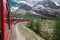 Bernina express on Switzerland. It is landmark of Swiss Alps. Nice Alpine landscape in summer. Red glacier train on