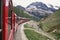 Bernina express on Switzerland. It is landmark of Swiss Alps. Nice Alpine landscape in summer. Red glacier train on