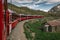 Bernina express on Switzerland. It is landmark of Swiss Alps. Nice Alpine landscape in summer. Red glacier train on