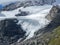 The Bernina glaciers during the summer time. View of the glaciers from Lake White. Slowly retreating glaciers on the Alps