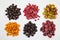 Berries of blueberries, red and black currants, sea buckthorn, raspberries, grapes, quick-frozen, laid out in small piles