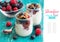 Berries, flakes and fresh greek yogurt in a jar