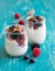 Berries, flakes and fresh yogurt in a jar