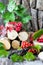 Berries and leaves of a viburnum on a piece of bark