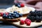 Berries mix blueberry, raspberry on rustic wooden table