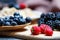 Berries mix blueberry, raspberry on rustic wooden table