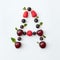Berries pattern of letter A english alphabet from natural ripe berries - black currant, cherries, raspberry, mint leaf