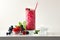 Berries slush drink with fruit and ice and isolated background