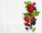 Berries with spoon on Wooden Background. Health, Diet, Gardenin