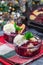 Berry cobbler in glass ramekin with ice cream, Christmas decoration with bokeh, vertical