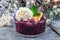 Berry cobbler in glass ramekin with ice cream, Christmas decoration, horizontal