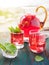 Berry compote decanter glasses with apple slices on wooden rustic background solar.