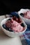 berry cottage cheese cream in white sauce bowls, the dish is decorated with fresh berries