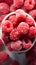 Berry frost View from above, frozen organic raspberries in bowl