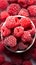 Berry frost View from above, frozen organic raspberries in bowl