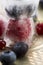 Berry fruits frozen in ice cubes