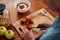 A berry healthy start to the day. an unrecognisable woman making a healthy breakfast at home.