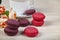Berry macaroons. white cup and rose