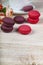 Berry macaroons. white cup and rose