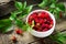 Berry raspberries on a wooden table rustic.