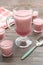 Berry smoothie pink on a wooden table. selective focus