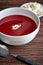 Berry soup with cottage cheese and a spoon in the foreground