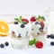 Berry yogurt yoghurt with berries fruits cup muesli square wooden board copyspace breakfast