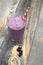 Berryand steel cut oats smoothie on a wood background