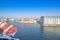 Berth cargo port with cranes on the background of the morning sky