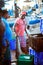 Beruwala, Sri Lanka - 10 February, 2017: Group of sellers and customers bargain at fish market in Bentota or Aluthgama area