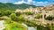 Besalu Cityscape under blue sky & water reflection in Catalonia, Spain