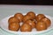 Besan Laddoo - Roasted gram flour mixed with Ghee and sugar to make round shape balls,  Indian sweets