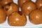 Besan Laddoo - Roasted gram flour mixed with Ghee and sugar to make round shape balls,  Indian sweets