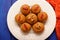 Besan laddu, vegan Indian sweets with wallnuts and goji berries