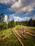 Beskid Sadecki, Beskids, Beskidy summer view of a male and female sitting a wooden chopped cut trees on red trail to the Hala