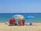 Best beaches of Pelion peninsula. Bright colored umbrellas. Pagasetic gulf. Greece.