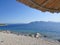 Best beaches of Pelion peninsula. Bright colored umbrellas. Pagasetic gulf. Greece.